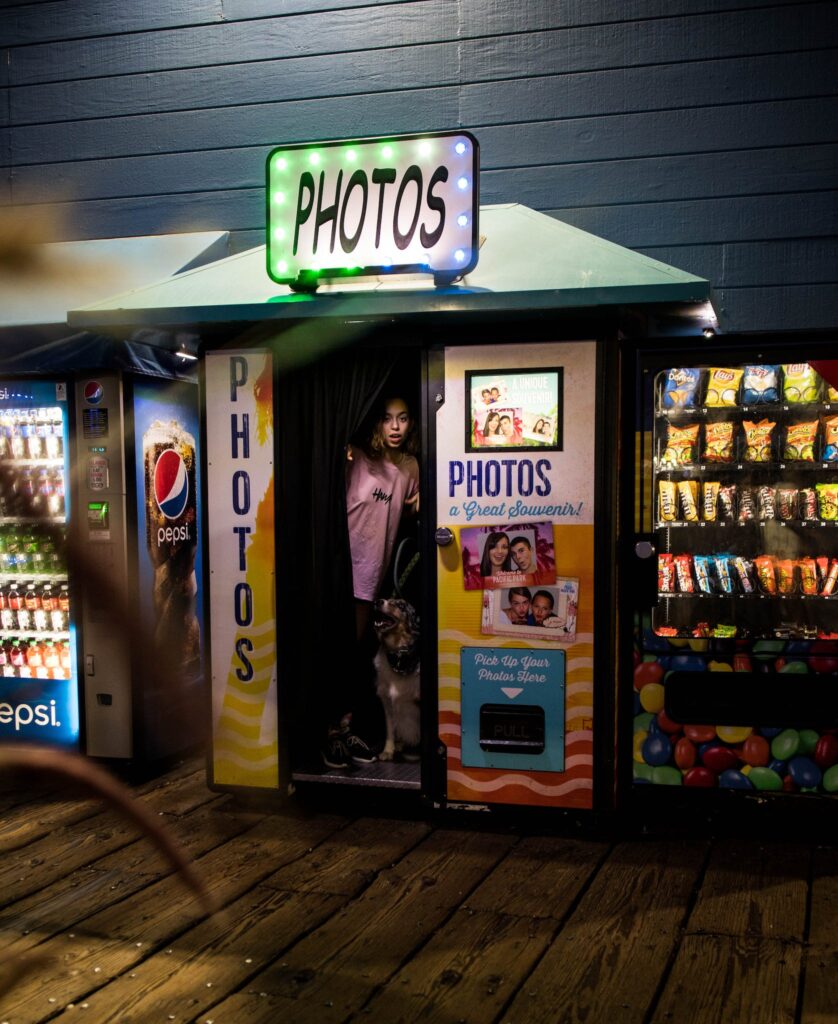 Photo Of Woman Standing Inside Photo Booth