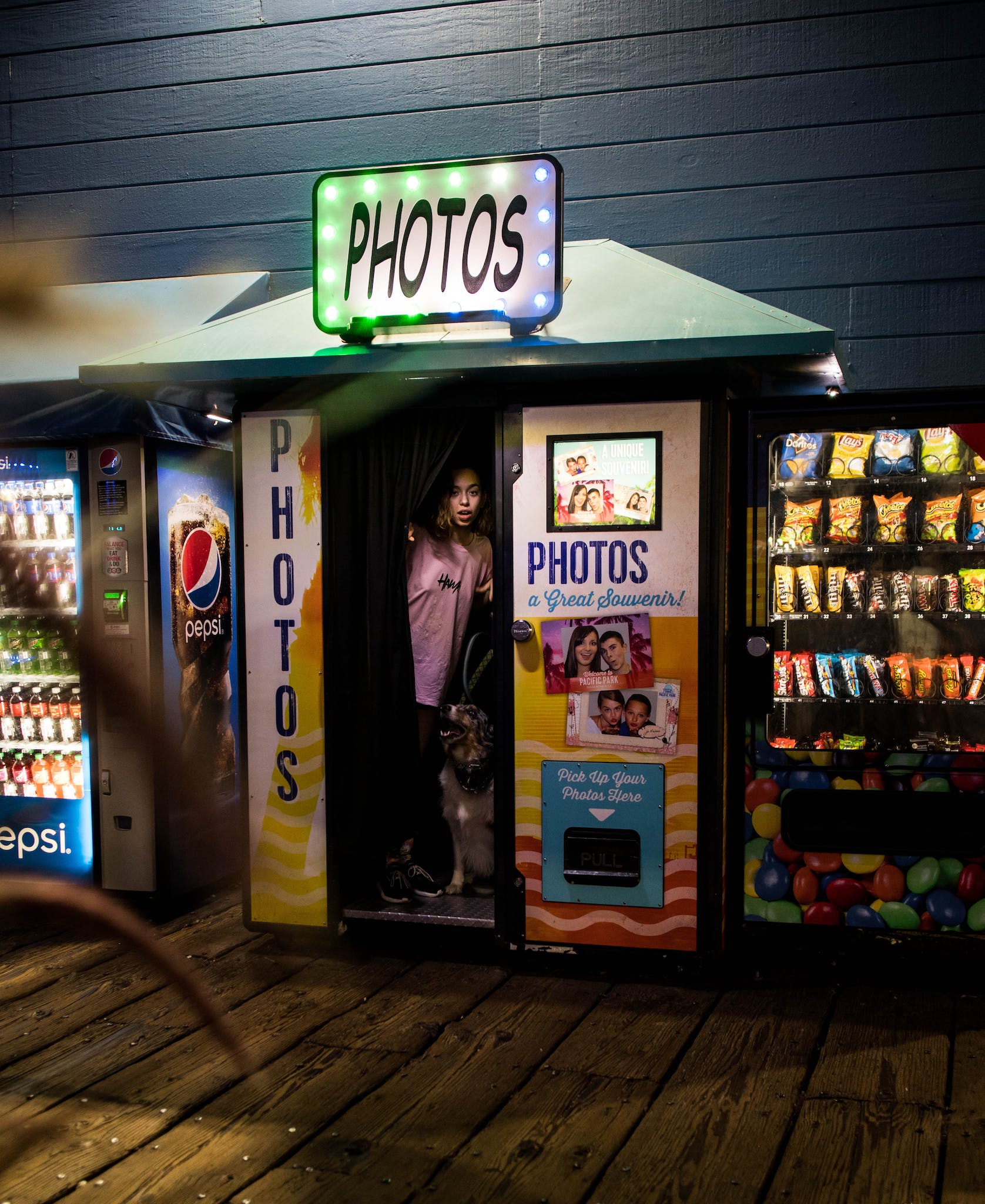 Photo Of Woman Standing Inside Photo Booth